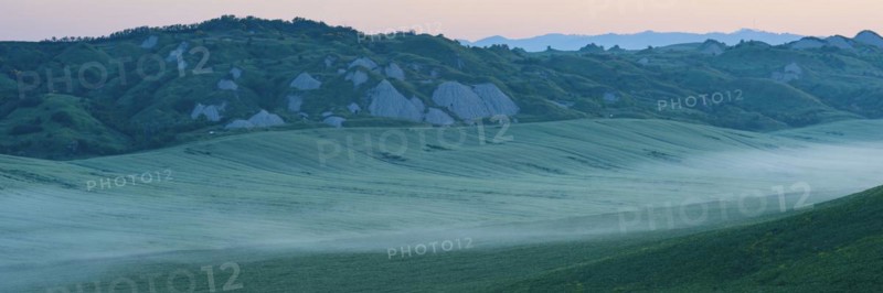 Early morning fog shortly in front of sunrise in the Crete Senesi, Province of Siena, Tuscany, Italy, Europe