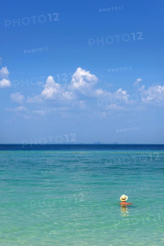 Man with hat bathing in the sun in the sea, ocean, Andaman Sea, ozone, heat, sunstroke, sunscreen, skin cancer, protection, protect, caution, tropics, tropical, summer holiday, summer, water, beach, bathing, swimming, beach holiday, Caribbean, environment, clear, clean, peaceful, climate, travel, tourism, paradisiacal, beach holiday, sun, sunny, holiday, paradise, nature, idyllic, turquoise, exotic, travel photo, sandy beach, seascape, Phi Phi Island, Thailand, Asia