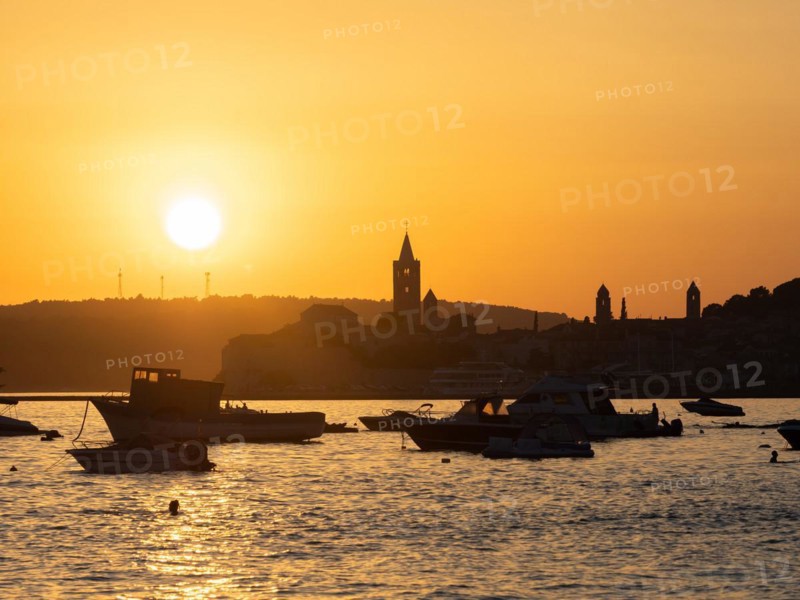 Boats anchoring in a bay, silhouette of a church tower, sunset over Rab, town of Rab, island of Rab, Kvarner Gulf Bay, Croatia, Europe