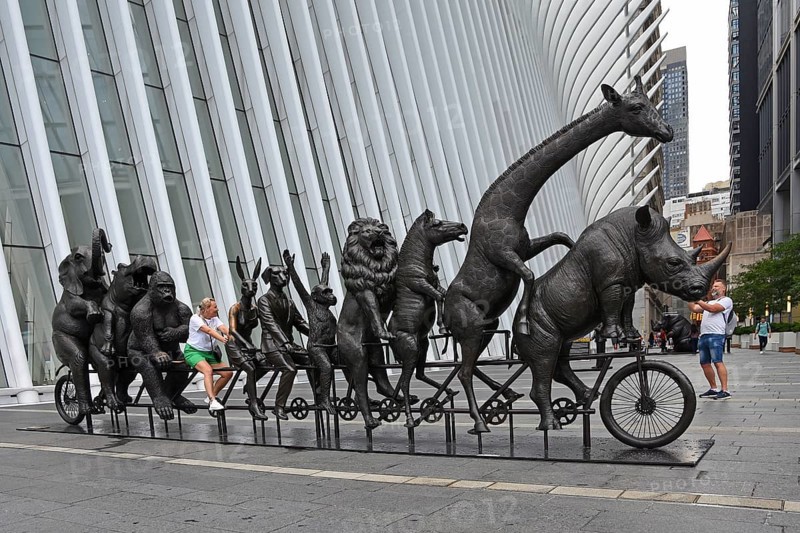 Artwork for endangered animals, bronze sculptures on bicycle, exhibition A Wild Life for Wildlife, artists Gillie and Marc, in front of Oculus building, Transportation Hub, Ground Zero, Lower Manhattan, New York City, New York, USA, North America