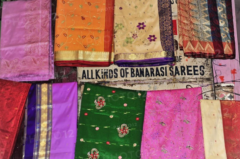 Colourful selection of saris with different patterns at a market, Varanasi, Uttar Pradesh, India, Asia