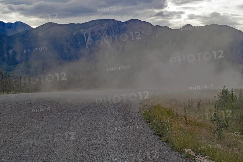 Long plume of dust on a gravelled section of the Alaska Highway, Yukon Territory, Canada, North America