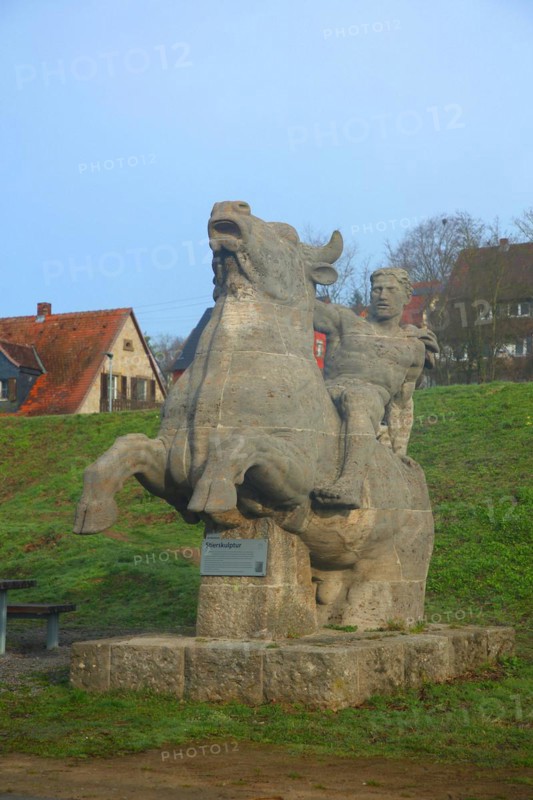 Sculpture bull figure by Wilhelm Ax 1939 made of stone, ox, ox figure, Ochsenfurt, Lower Franconia, Franconia, Bavaria, Germany, Europe