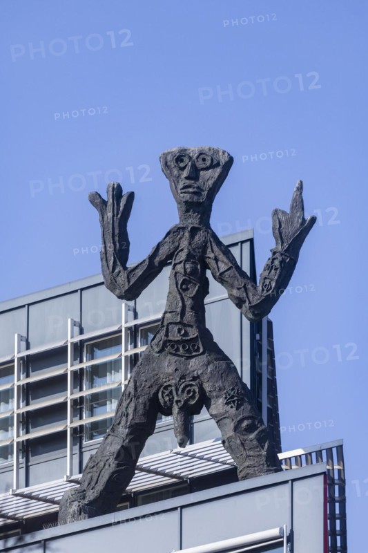On the acute-angled corner of the building at the junction of Maxstrasse and Ostra-Allee stands a four-metre bronze sculpture of a stick figure created by A. R. Penck, Dresden, Saxony, Germany, Europe