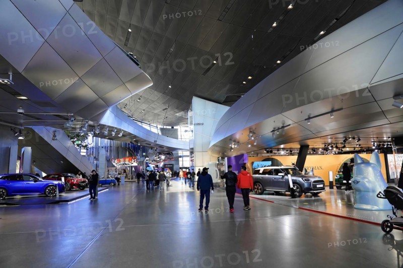 A car exhibition in a spacious hall with several visitors, BMW WELT, Munich, Germany, Europe