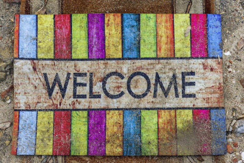 Doormat with the word welcome, greeting, friendly, inviting, colourful, colourful, decoration, word, colourful, greeting, greeting message, background, texture, carpet, mat, entrance, front door