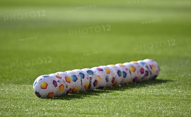 Adidas Derbystar match balls lie in a row on the pitch, Voith-Arena, Heidenheim, Baden-Wuerttemberg, Germany, Europe