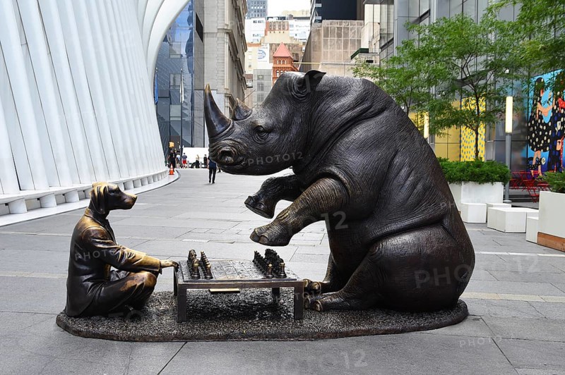 Bronze artwork for endangered animals, rhino and dog playing chess, exhibition A Wild Life for Wildlife, artists Gillie and Marc, in front of Oculus building, Transportation Hub, Ground Zero, Lower Manhattan, New York City, New York, USA, North America
