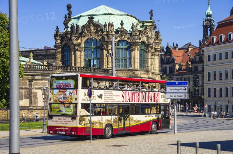 A red double-decker bus for city tours in front of the Zwinger on Sophienstrasse in Dresden, Saxony, Germany, for editorial use only, Europe