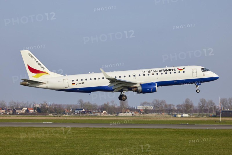 German Airways Embraer E190SR with registration D-AKJC lands on the Polderbaan, Amsterdam Schiphol Airport in Vijfhuizen, municipality of Haarlemmermeer, Noord-Holland, Netherlands