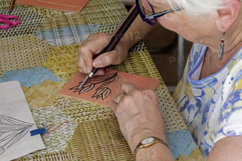 Oaxaca, Mexico, Susan Newell works on her image of tulips at an engraving workshop led by Alejandra Canseco Alhil at her art studio, Central America