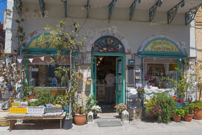 An inviting bookshop with an open door and a wide variety of articles in the entrance area, Koroni Old Town, Pylos-Nestor, Messinia, Peloponnese, Greece, Europe
