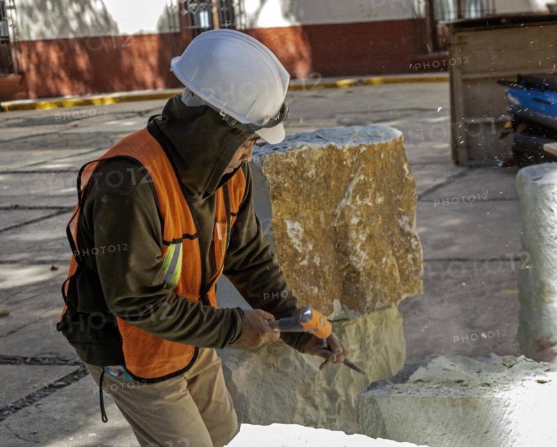 Oaxaca, Mexico, A worker chisels a block of stone to use in repairs on Guadalupe Church, Central America