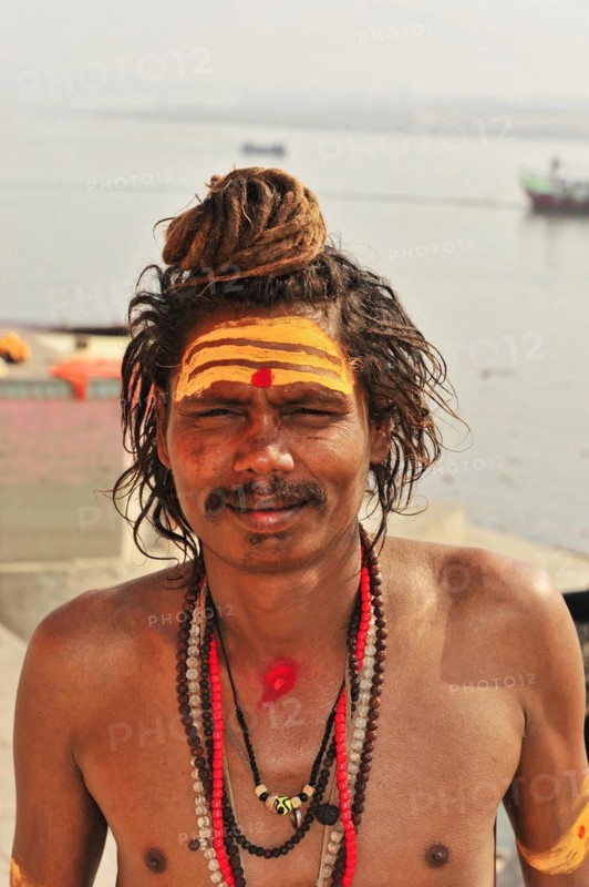 Portrait of a sadhu with face painting and religious symbols in Varanasi, Varanasi, Uttar Pradesh, India, Asia