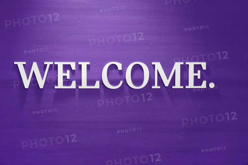 A simple purple wall with 'WELCOME.' in white lettering as a greeting, BMW WELT, Munich, Germany, Europe