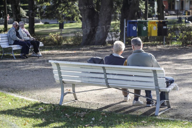 Retired couples sitting on benches in a park, Bad Harzburg, 06.10.2018