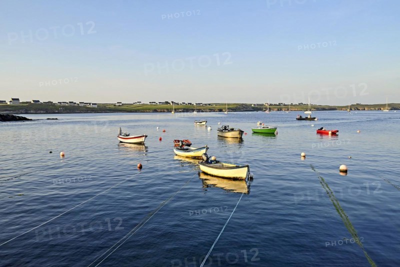 Boats on the blue waters of a bay, Ouessant Island, Finistere, Brittany, France, Europe