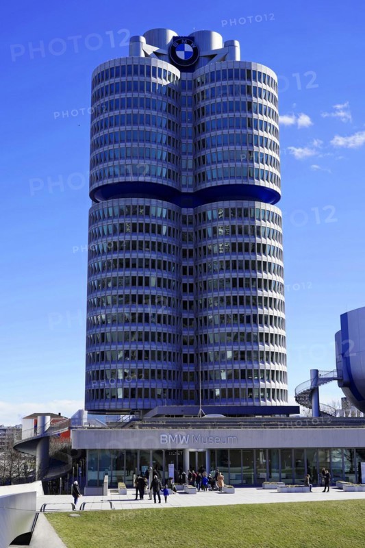 The BMW building with its striking shape and people in front of it on a sunny day, BMW WELT, Munich, Germany, Europe