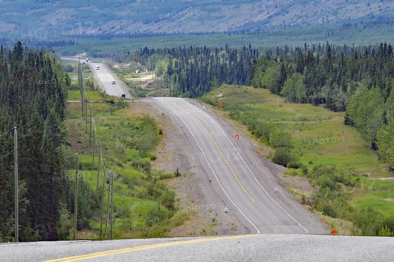 Road leads as endless grades through wilderness, constant ups and downs, Alaska Highway, Yukon Territory, Canada, North America