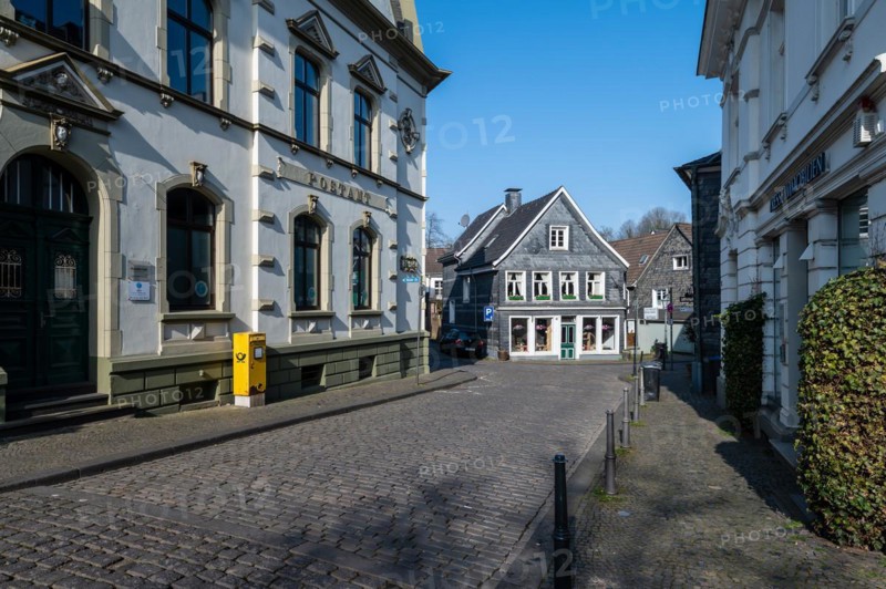 A deserted street surrounded by traditional half-timbered architecture on a clear day, Graefrath, Solingen, Bergisches Land, North Rhine-Westphalia