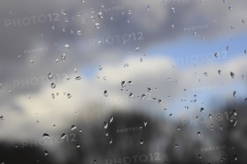 Raindrops on a window pane, North Rhine-Westphalia, Germany, Europe