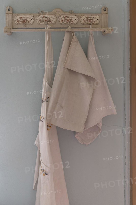 Decorative board with hooks for tea towels and aprons in a 19th century kitchen, Open-Air Museum of Folklore Schwerin-Muess, Mecklenburg-Western Pomerania, Germany, Europe