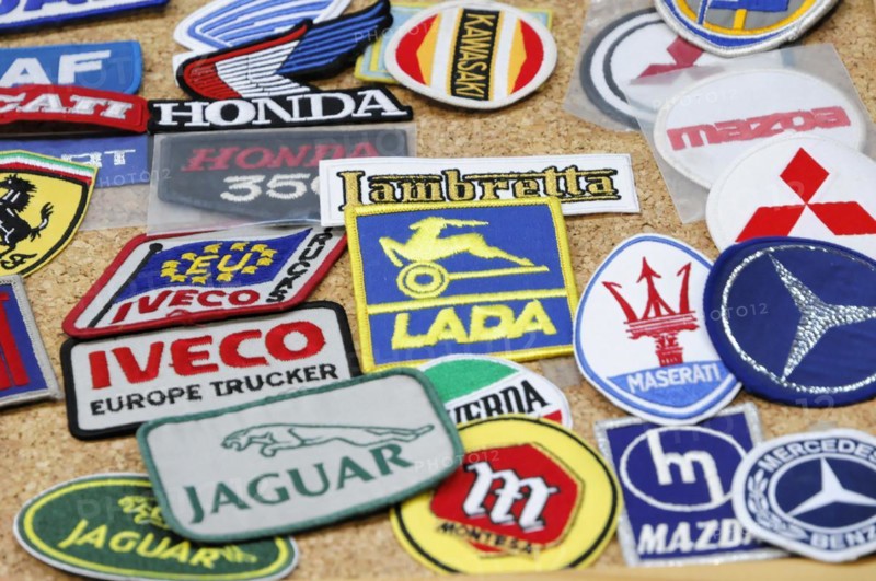 RETRO CLASSICS 2010, Stuttgart Messe, Collection of different colourful patches with car brand logos on a table, Stuttgart Messe, Stuttgart, Baden-Wuerttemberg, Germany, Europe