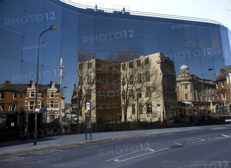 Buildings reflected in glass of award winning Willis Corroon building, architect Norman Foster, Ipswich, Suffolk, England, UK