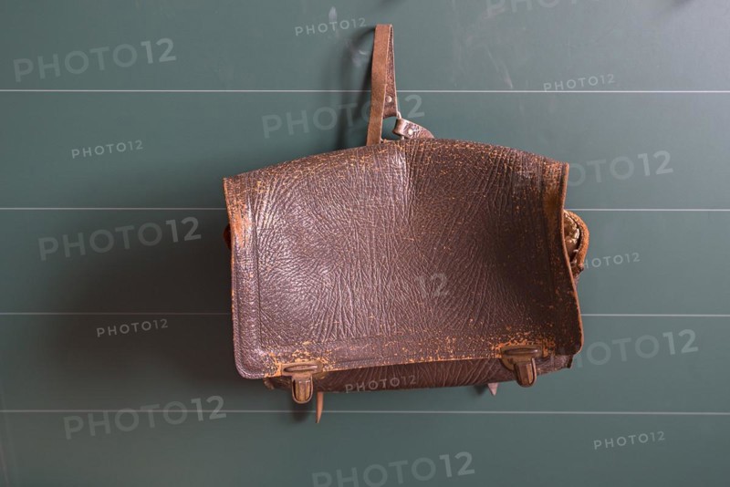 Leather school bag hanging in a classroom from the 19th century, Open-Air Museum of Folklore Schwerin-Muess, Mecklenburg-Vorpommerm, Germany, Europe