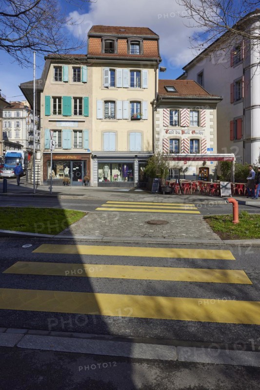 Old pastel-coloured houses with white windows and wooden shutters and the Cafe Vieil Ouchy on a zebra crossing in the Ouchy district, Lausanne, district of Lausanne, Vaud, Switzerland, Europe