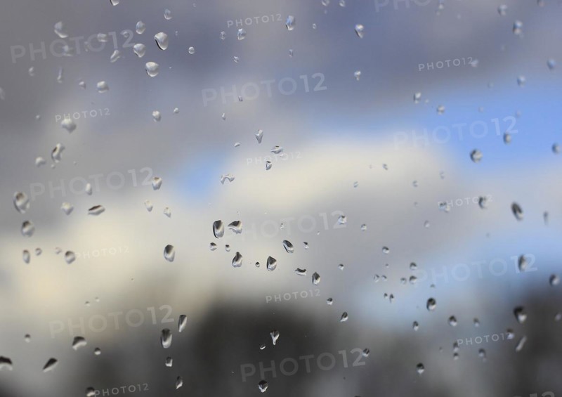 Raindrops on a window pane, North Rhine-Westphalia, Germany, Europe