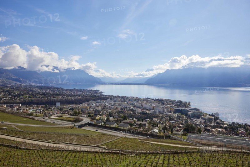 Main road 12 leads through the UNESCO World Heritage vineyard terraces of Lavaux with views of Vevey and Lake Geneva from the Jongny site, Riviera-Pays-d'Enhaut district, Vaud, Switzerland, Europe