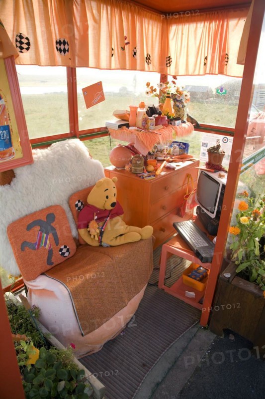 Orange colour theme decorated bus shelter, Haroldswick, Unst, Shetland Islands, Scotland, United Kingdom, Europe