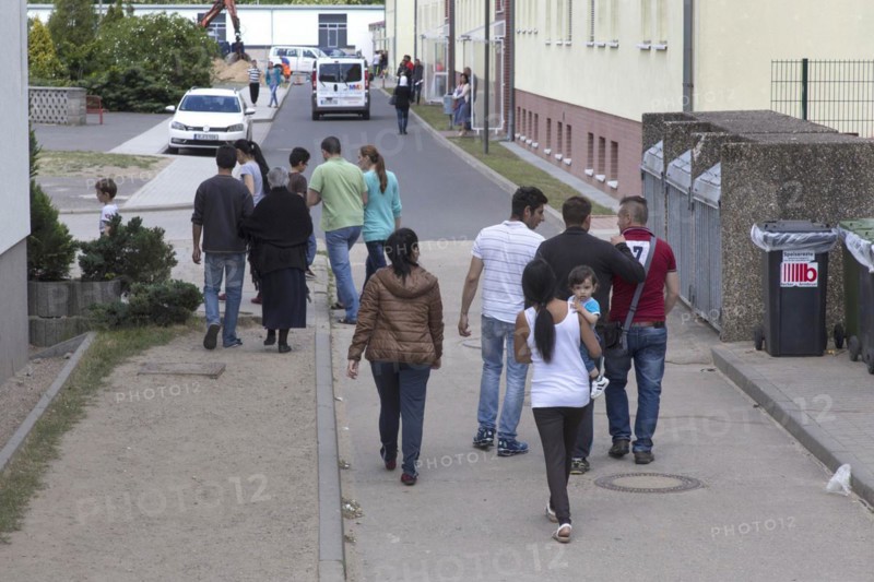 Refugees at the central contact point for asylum seekers in Brandenburg, Eisenhuettenstadt, 3 June 2015