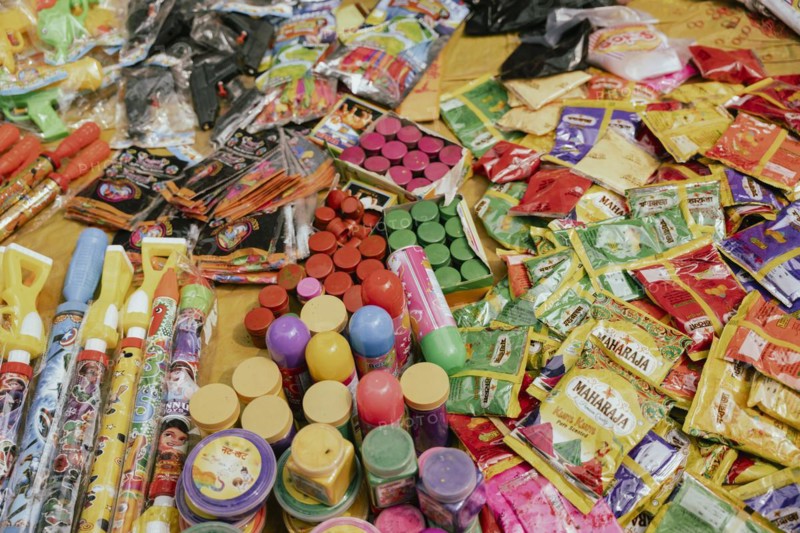 Vendor sells Holi celebration items in a street market, ahead of Holi festival on March 23, 2024 in Guwahati, Assam, India. Holi is the Hindu festival of colours, it is celebrated with great joy in India