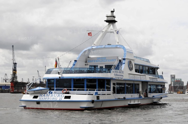 An excursion boat with a blue hull and white superstructure sails through Hamburg harbour, Hamburg, Hanseatic City of Hamburg, Germany, Europe