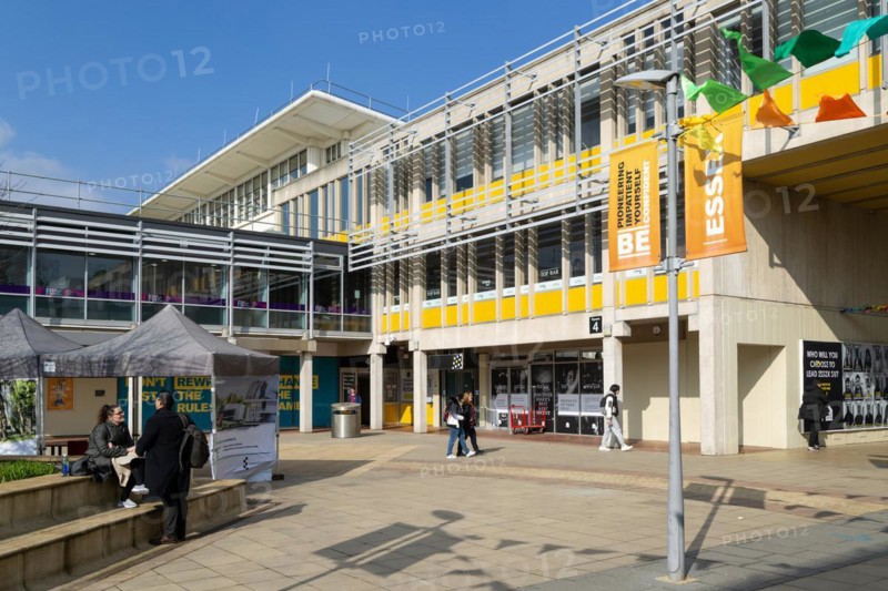 Students in one of the campus squares, University of Essex, Colchester, Essex, England, UK