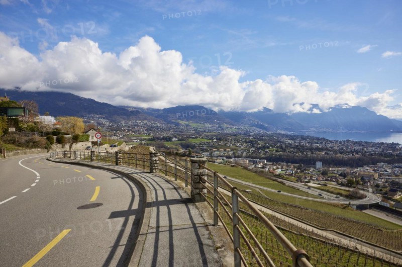 Main road 12 leads through the UNESCO World Heritage vineyard terraces of Lavaux with views of Vevey and Lake Geneva from the Jongny site, Riviera-Pays-d'Enhaut district, Vaud, Switzerland, Europe