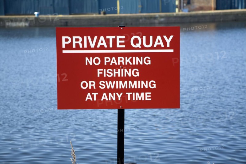 Private Quay sign no swimming fishing parking at any time, Wet Dock, Ipswich, England, UK