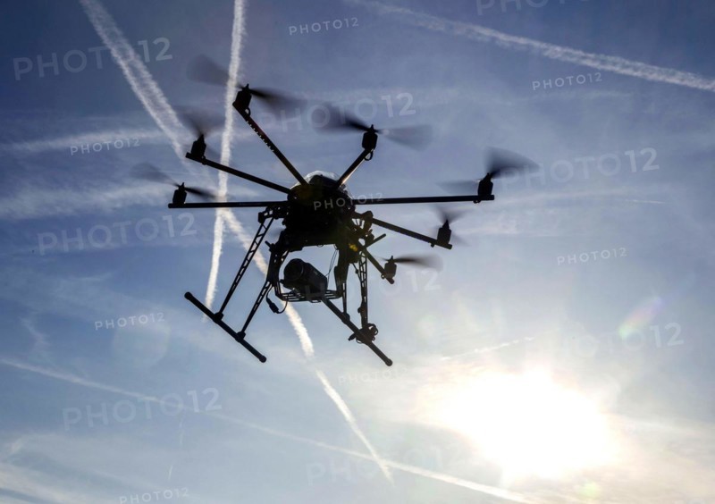 An octocopter drone filming with a video camera, 10.12.2015