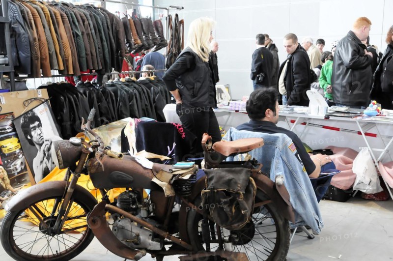 Flea market stand with vintage motorbike, clothes and people in the background, Stuttgart Messe, Stuttgart, Baden-Wuerttemberg, Germany, RETRO CLASSICS 2010, Europe