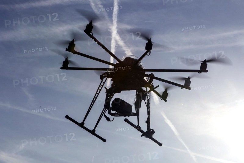 An octocopter drone filming with a video camera, 10.12.2015