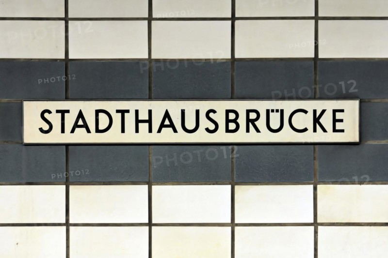 A sign with the inscription Stadthausbruecke on a wall with blue tiles, Hamburg, Hanseatic City of Hamburg, Germany, Europe