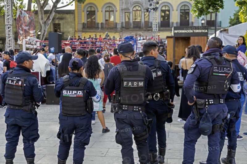 Oaxaca, Mexico, Police officers keep watch outside a youth boxing match in the zocalo, Central America