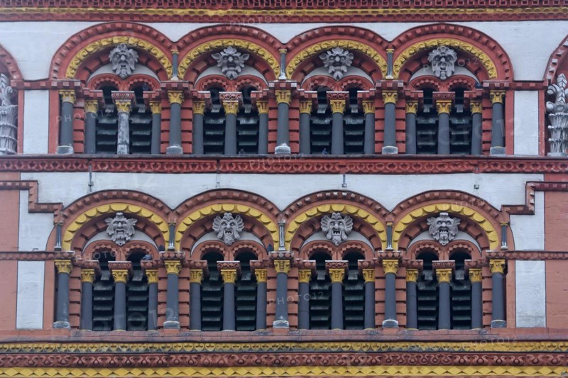 Detail with window, columns and grimaces from the tower of the Romanesque church of St Matthias, ornaments, figures, Benedictine Abbey, Trier, Rhineland-Palatinate, Germany, Europe