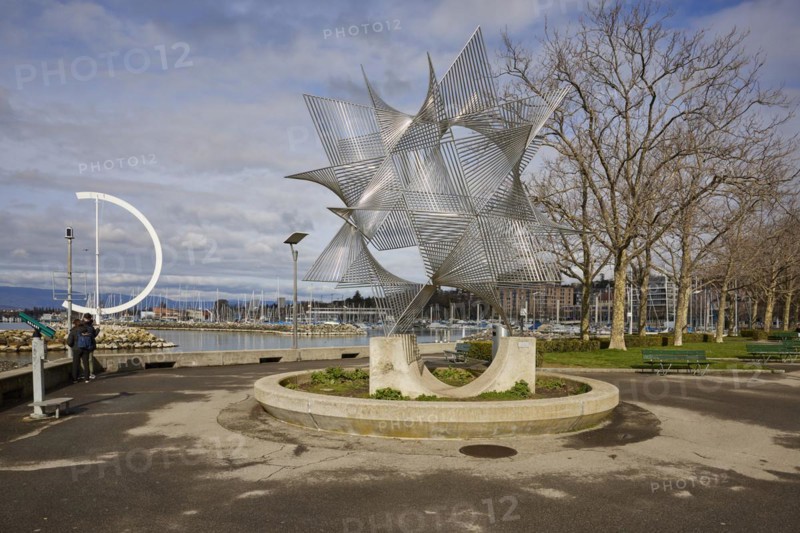 Art object Ouverture au Monde by artist Angel Duarte and the large, semi-circular wind vane Eole, a sculpture by artist Clelia Bettua, in Lake Geneva within the Ouchy harbour in the Ouchy district, Lausanne, district of Lausanne, Vaud, Switzerland, Europe