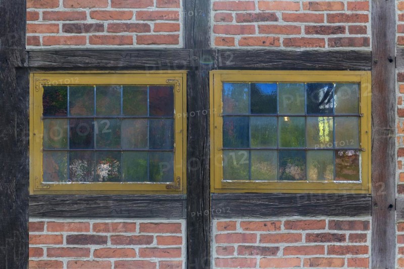 Colourful window panes of a 19th century smithy, Open-Air Museum of Folklore Schwerin-Muess, Mecklenburg-Western Pomerania, Germany, Europe