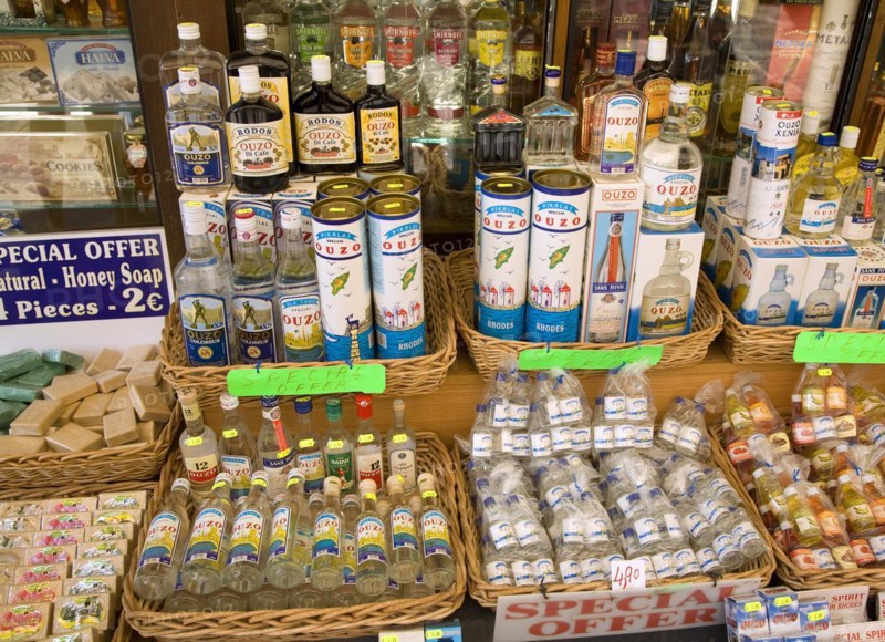Shop display bottles of ouzo, Rhodes, Greece, Europe
