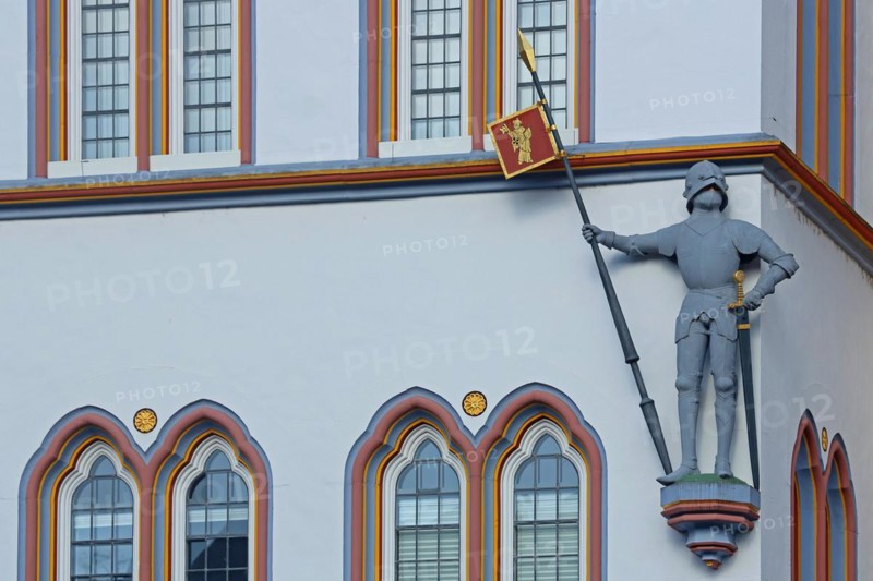 Knight with armour, lance, helmet and sword at the historic house Steipe built in 1430, figure, statue, Middle Ages, house wall, window, detail, main market, Trier, Rhineland-Palatinate, Germany, Europe