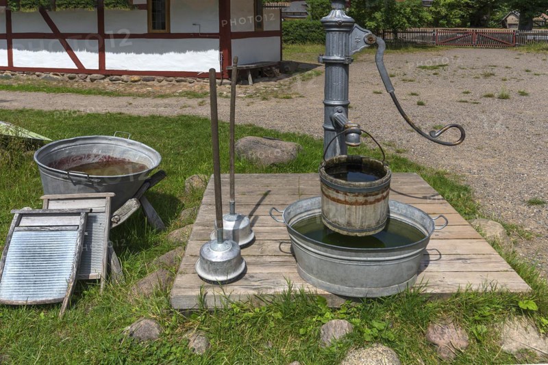 Laundry area with water pump in the garden from the 19th century, Open-Air Museum of Folklore Schwerin-Muess, Mecklenburg-Vorpommerm, Germany, Europe